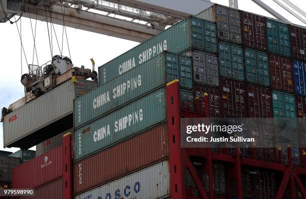 Shipping container is offloaded from the Hong Kong based CSCL East China Sea container ship at the Port of Oakland on June 20, 2018 in Oakland,...