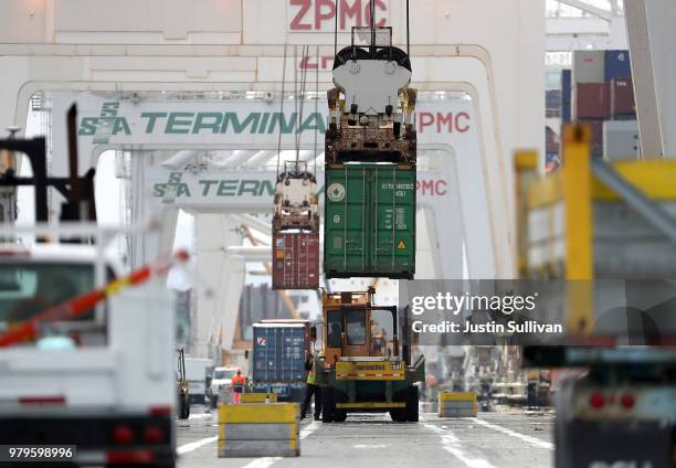 Shipping container is offloaded from the Hong Kong based CSCL East China Sea container ship at the Port of Oakland on June 20, 2018 in Oakland,...