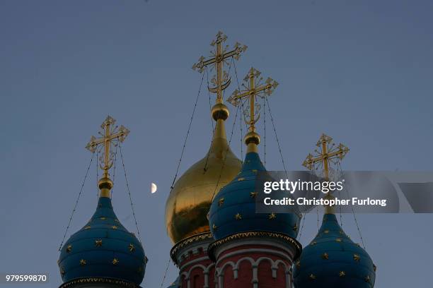 The moon rises over the Temple of St. George the Victorious near Red Square on June 20, 2018 in Moscow, Russia. Uruguay's 1-0 win over Saudi Arabia...