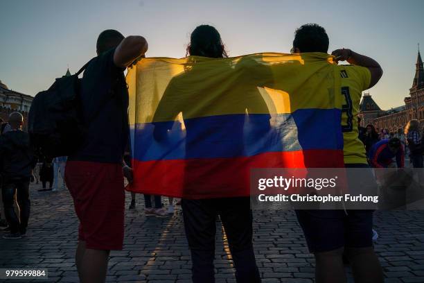 Football fans in Red Square pose for photographs on June 20, 2018 in Moscow, Russia. Uruguay's 1-0 win over Saudi Arabia has ensured that they and...