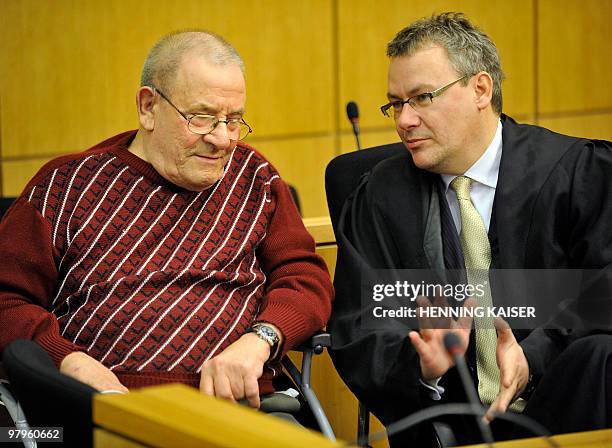 Year-old former SS hit man Heinrich Boere and his lawyer Gorden Christiansen wait for the verdict in his trial on March 23, 2010 at court in Aachen,...