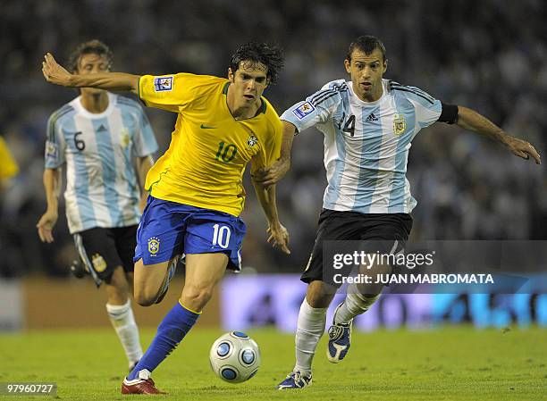 Brazil's midfielder Kaka vies for the ball with Argentina's midfielder Javier Mascherano during their FIFA World Cup South Africa-2010 qualifier...