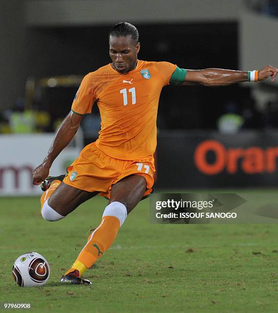 Striker and team captain Didier Drogba of Ivory Coast National football team, the 'Elephants' controls the ball during their group stage match...