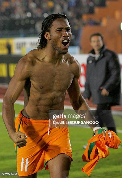 Ivorian Elephants' Didier Drogba jubilates after his score beat Cameroons in the quarter final match of the African Cup of Nations 04 February 2006...