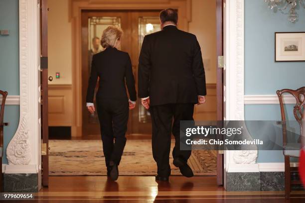 German Defense Minister Ursula von der Leyen and U.S. Secretary of State Mike Pompeo walk out of the Treaty Room after posing for photographs at the...