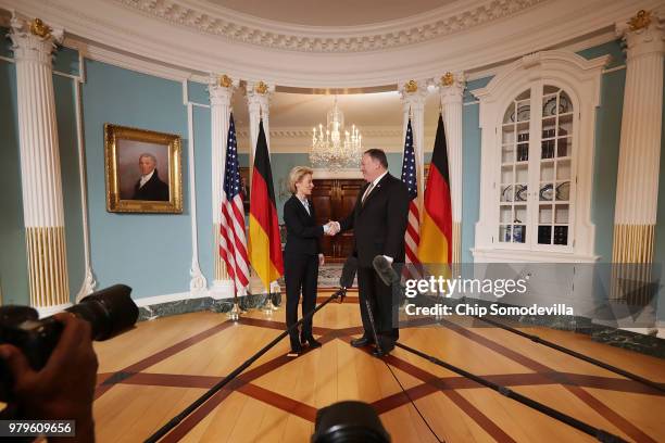 German Defense Minister Ursula von der Leyen shakes hands and poses for photographs with U.S. Secretary of State Mike Pompeo before meetings in the...