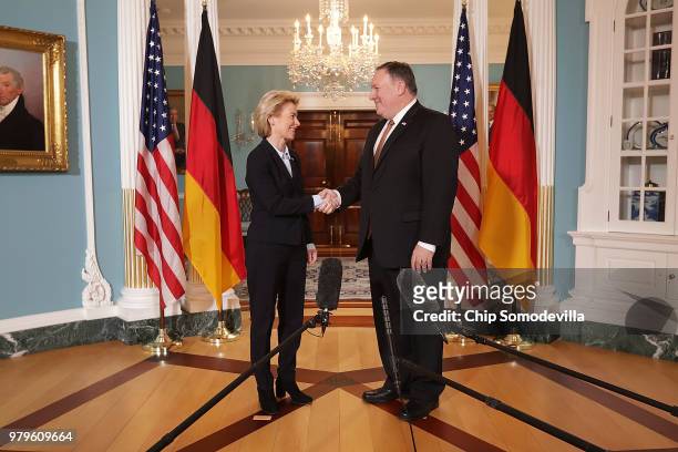 German Defense Minister Ursula von der Leyen shakes hands and poses for photographs with U.S. Secretary of State Mike Pompeo before meetings at the...