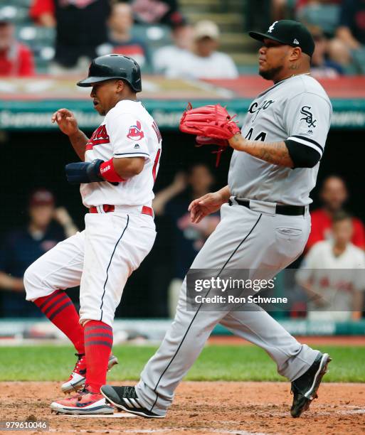 Jose Ramirez of the Cleveland Indians scores on a wild pitch past pitcher Bruce Rondon of the Chicago White Sox during the sixth inning at...