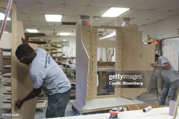 Workers build wood interiors for boats at the Winnebago Industries Inc. Chris-Craft manufacturing facility in Sarasota, Florida, U.S., on Tuesday,...