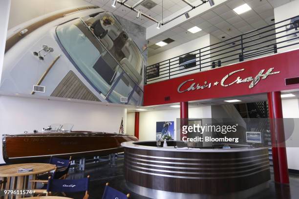 Signage is displayed above the receptionist counter in the lobby of the Winnebago Industries Inc. Chris-Craft boat manufacturing facility in...