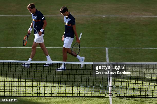 Pierre-Hughes Herbert and Nicolas Mahut of France in action during their doubles match against Nick Kyrgios and Lleyton Hewitt of Australia on Day...
