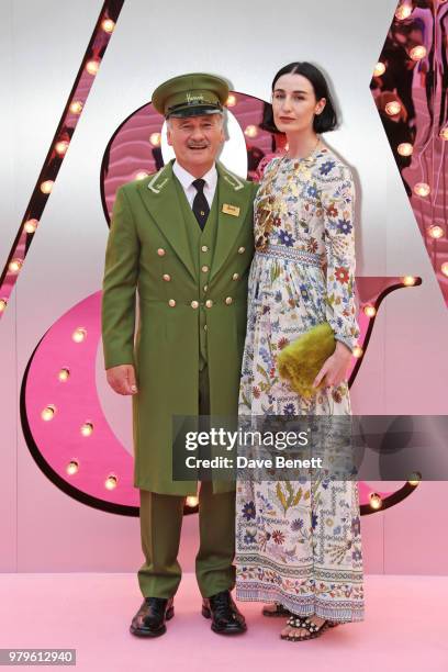 Erin O'Connor poses with the Harrods Green Man at the Summer Party at the V&A in partnership with Harrods at the Victoria and Albert Museum on June...