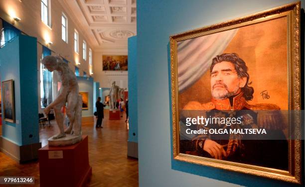 Portrait of Argentina's legend Diego Maradona is on display during the opening of the Art Project 'Like the Gods', presented by the Museum of the...