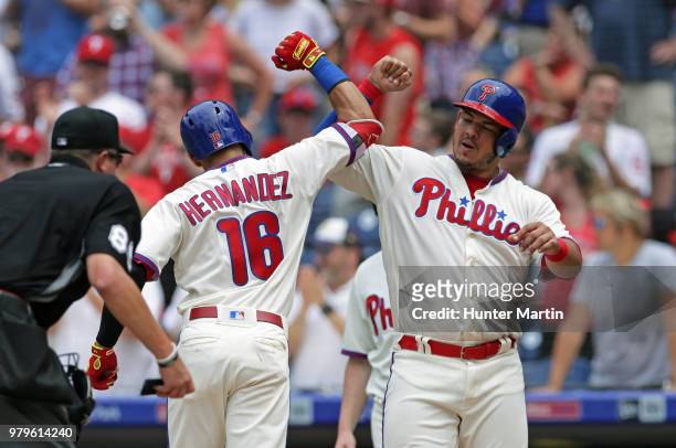 Cesar Hernandez of the Philadelphia Phillies celebrates with Jorge Alfaro after hitting a two-run home run in the fourth inning during a game against...