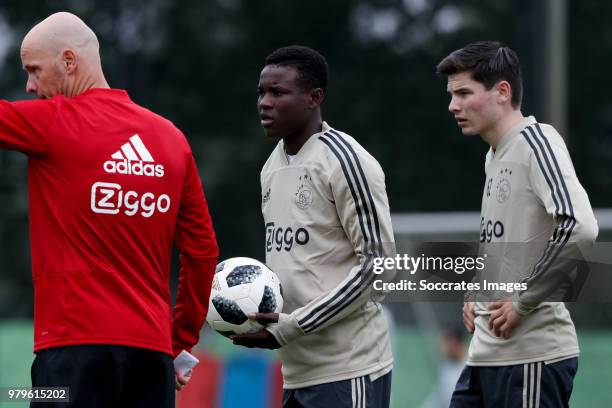 Coach Erik ten Hag of Ajax, Hassane Bande of Ajax, Jurgen Ekkelenkamp of Ajax during the First Training Ajax at the De Toekomst on June 20, 2018 in...