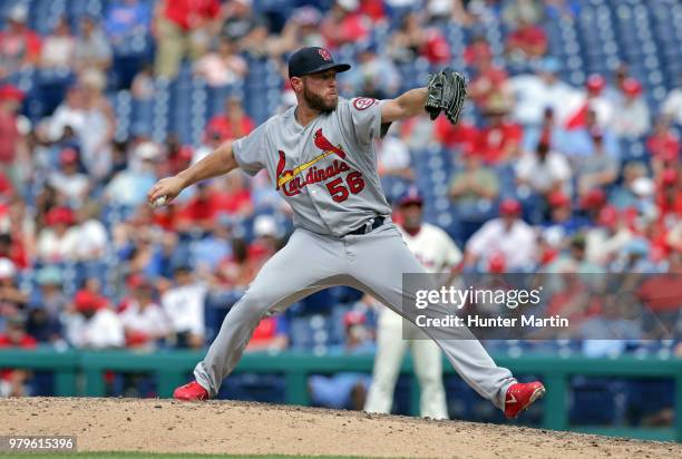 Greg Holland of the St. Louis Cardinals delivers a pitch in the eighth inning during a game against the Philadelphia Phillies at Citizens Bank Park...