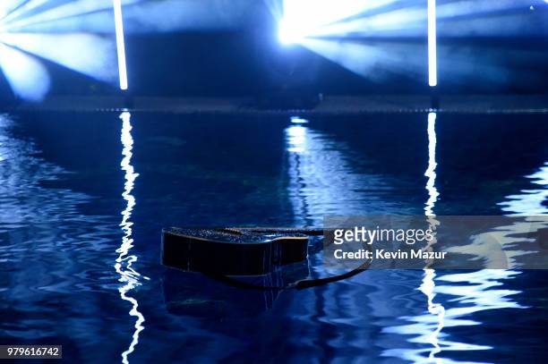 Billie Joe Armstrongs guitar floating in the pool after A Special Evening With Billie Joe Armstrong presented by Citi and Live Nation at Cannes Lions...