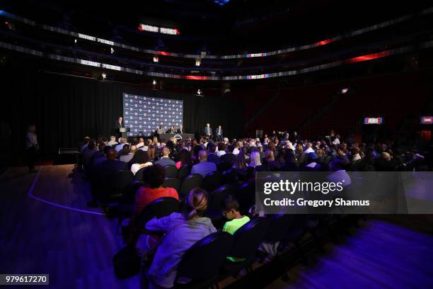 Dwane Casey talks while being introduced as the Detroit Pistons new head coach next to team owner Tom Gores at Little Caesars Arena on June 20, 2018...