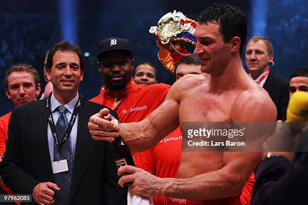 Wladimir Klitschko of Ukraine celebrates with a bottle of beer after winning his WBO Heavyweight World Championship fight against Eddie Chambers of...