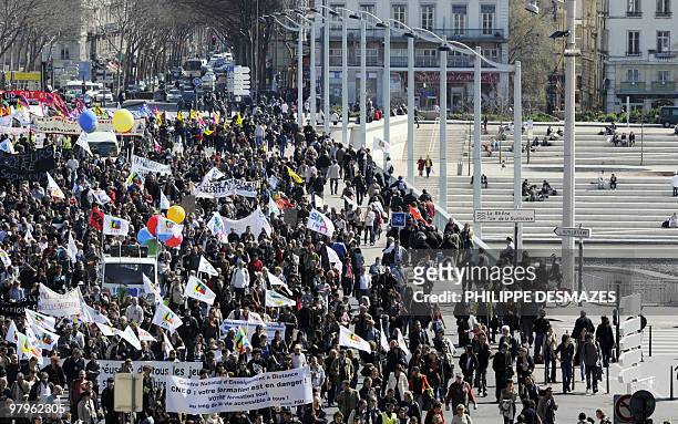 People demonstrate on March 23, 2010 in Lyon, as part of a nationwide day of protest against job cuts, wages, the high cost of living and plans for...