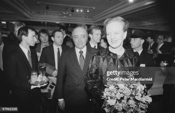 Egyptian businessman Mohamed Al-Fayed with Queen Margrethe II of Denmark in the food hall of Harrods, his London department store, 6th April 1989.