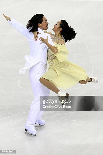 Xiaoyang Yu and Chen Wang of China compete in the Ice Dance Compulsory Dance during the 2010 ISU World Figure Skating Championships on March 23, 2010...