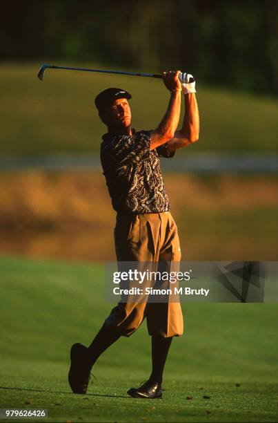 Payne Stewart of the USA hits a shot at the The Players Championship at the Tournament Players Club at TPC Sawgrass on March 28th, 1998 in Ponte...