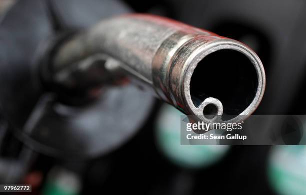In this photo illustration a drop of gasoline clings to a gasoline pump nozzle at a filling station on March 23, 2010 in Berlin, Germany. German...