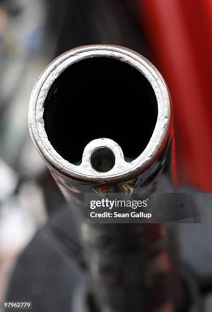 In this photo illustration a drop of gasoline clings to a gasoline pump nozzle at a filling station on March 23, 2010 in Berlin, Germany. German...