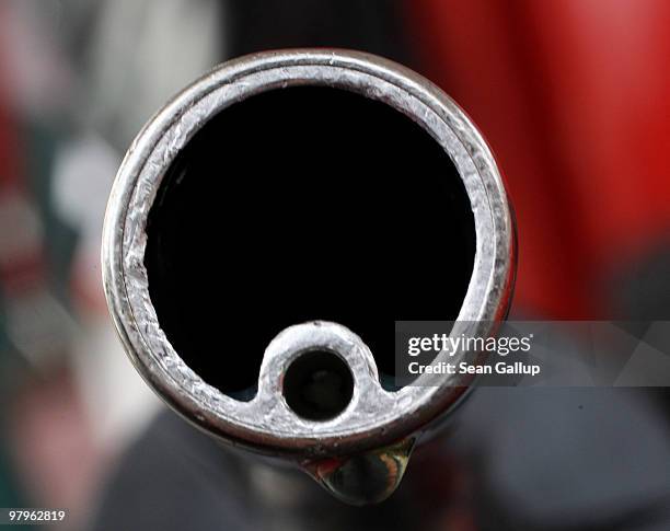 In this photo illustration a drop of gasoline clings to a gasoline pump nozzle at a filling station on March 23, 2010 in Berlin, Germany. German...