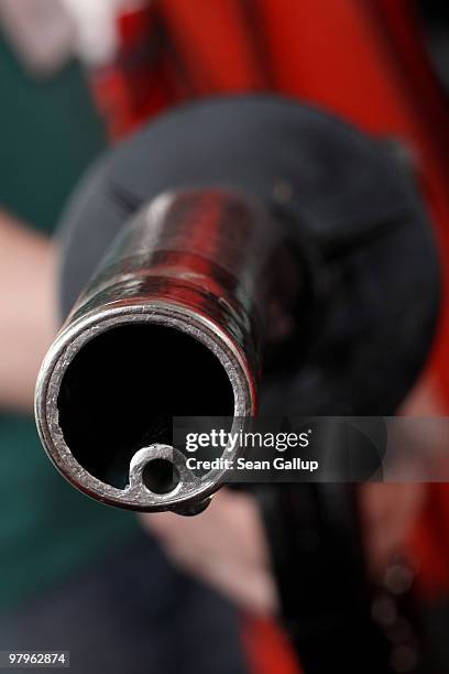 In this photo illustration a drop of gasoline clings to a gasoline pump nozzle at a filling station on March 23, 2010 in Berlin, Germany. German...