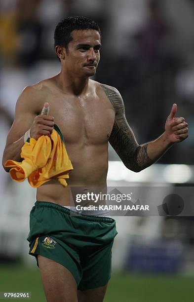 Australian national football player Tim Cahill gives a thumbs-up sign at the end of his team's 0-0 draw with Qatar during their World Cup 2010 Asian...