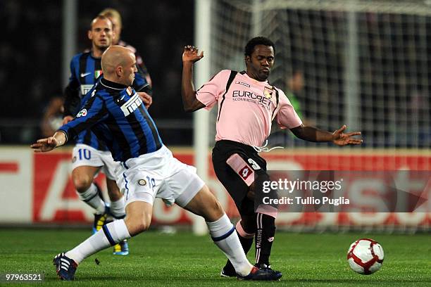 Esteban Cambiasso of Internazionale Milano and Fabio Simplicio of Palermo compete for the ball during the Serie A match between US Citta di Palermo...