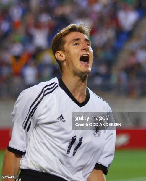 German forward Miroslav Klose reacts after he scored a goal during the Group E first round match Germany/Ireland of the 2002 FIFA World Cup in Korea...