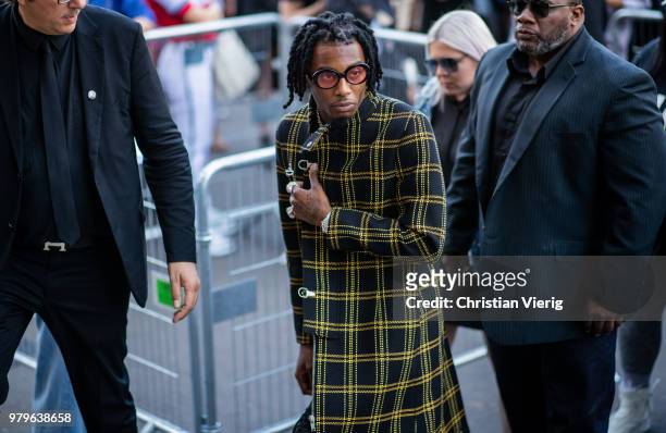 Playboi Carti wearing plaid coat is seen outside Off/White on day two of Paris Fashion Week Menswear SS19 on June 20, 2018 in Paris, France.