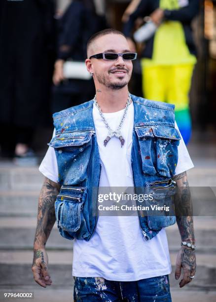 Balvin wearing denim vest is seen outside Off/White on day two of Paris Fashion Week Menswear SS19 on June 20, 2018 in Paris, France.