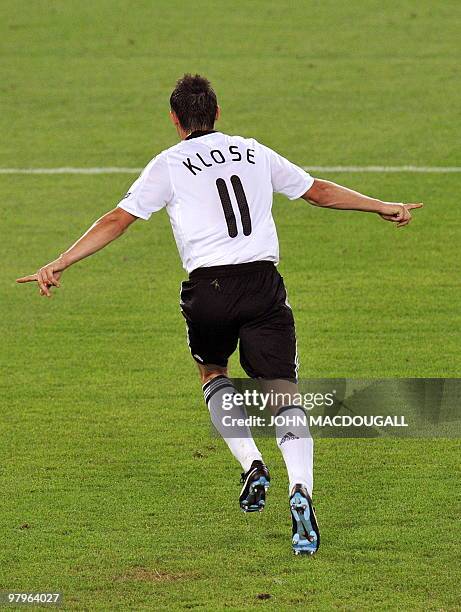 German forward Miroslav Klose celebrates after scoring his team's second goal during the Euro 2008 championships semi-final football match Germany...