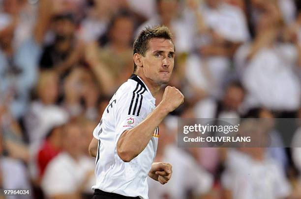 German forward Miroslav Klose gestures after scoring during the Euro 2008 championships semi-final football match Germany vs. Turkey on June 25, 2008...