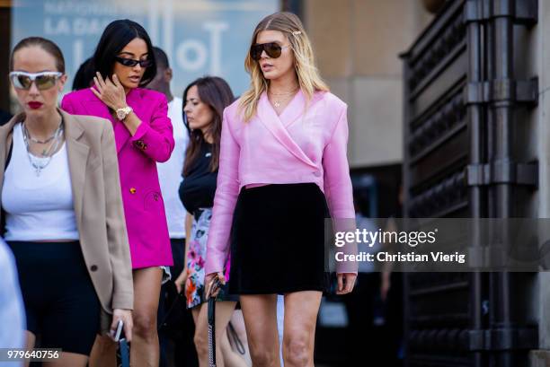 Model Maryna Linchuk wearing pink blouse, black mini skirt is seen outside Off/White on day two of Paris Fashion Week Menswear SS19 on June 20, 2018...