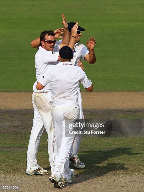 England bowler Graeme Swann and team mates celebrate the wicket of Bangladesh batsman Jahurul Islam during day four of the 2nd Test match between...