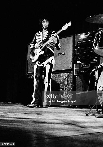 John Entwistle of The Who performs on stage on 20th September 1970 in Copenhagen, Denmark. He wears a skeleton jump suit.