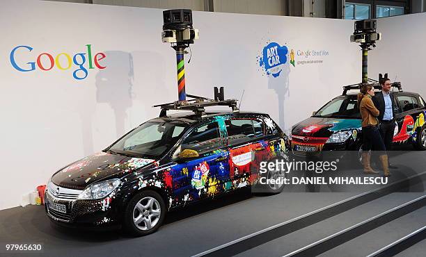 Cars equiped with special cameras, used to photograph whole streets, can be seen on the Google street-view stand at the world's biggest high-tech...