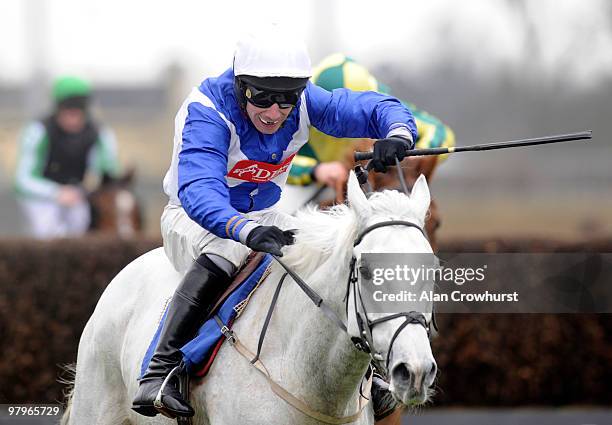 Power Shared and Wayne Hutchinson clear the last to win The Betdaq On 0870 178 1221 Novices' Handicap Steeple Chase at Kempton Park racecourse on...