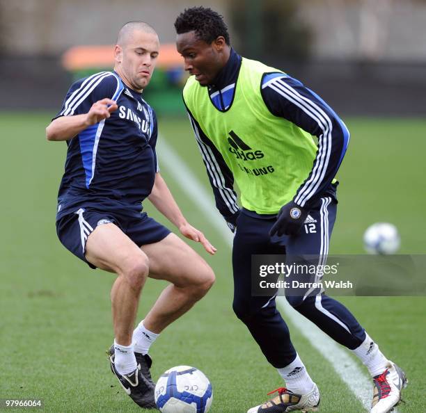 Joe Cole and John Mikel Obi of Chelsea during a training session at the Cobham training ground on March 23, 2010 in Cobham, England.