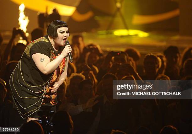 Singer of the band Gossip, Beth Ditto performs on stage at the "Echo" music awards in Berlin on March 4, 2010. AFP PHOTO DDP / MICHAEL GOTTSCHALK...