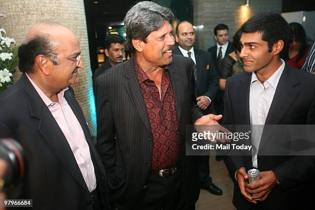 Formula One driver Karun Chandok with Kapil Dev and JK Tyre MD Raghupati Singhania during a feliciation function organised by JK Tyres in New Delhi...