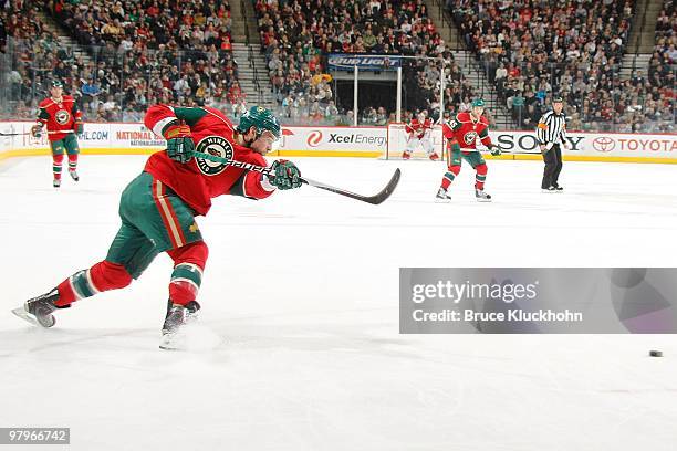 Guillaume Latendresse of the Minnesota Wild takes a slap shot against the Edmonton Oilers during the game at the Xcel Energy Center on March 16, 2010...