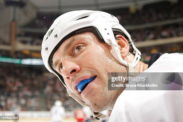 Jason Strudwick of the Edmonton Oilers has some words with John Scott of the Minnesota Wild during the game at the Xcel Energy Center on March 16,...