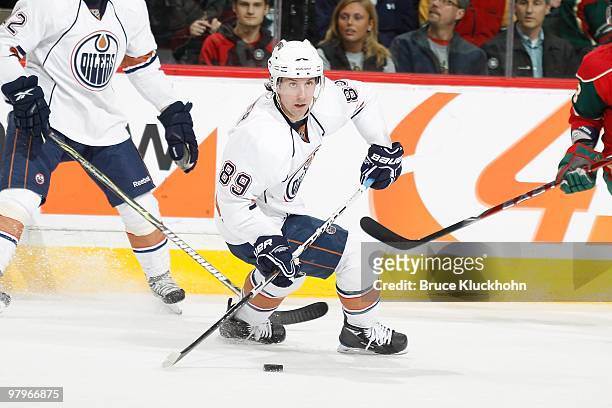 Sam Gagner of the Edmonton Oilers skates with the puck against the Minnesota Wild during the game at the Xcel Energy Center on March 16, 2010 in...