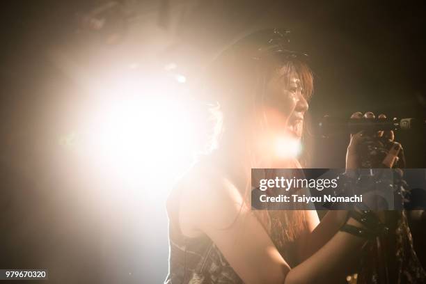 a woman rock singer in the light - anti disco ストックフォトと画像